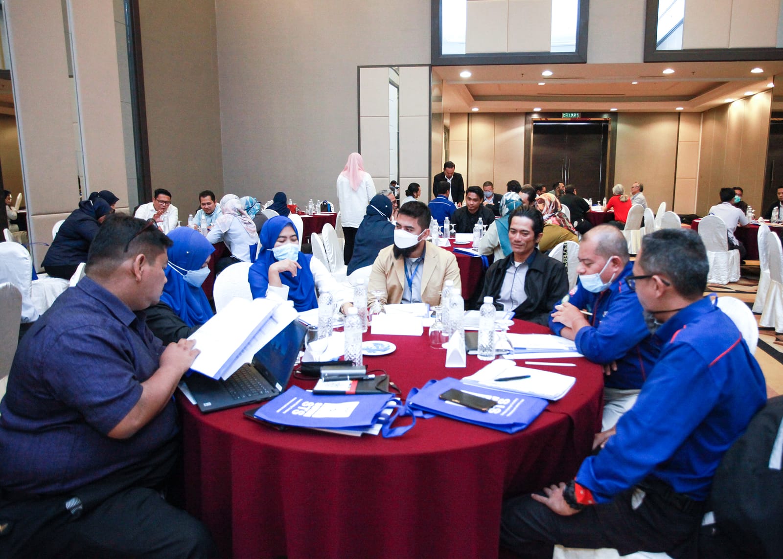 Participants working through documents at their tables